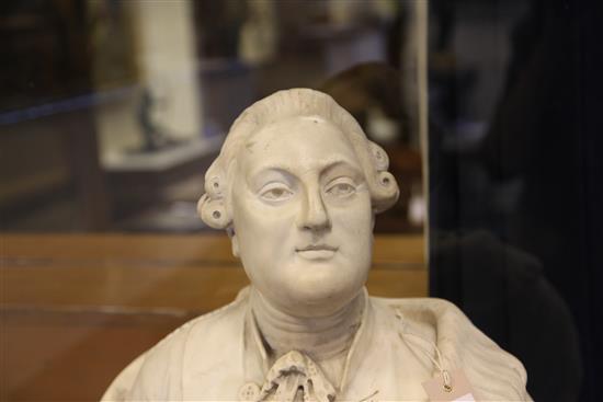 In the manner of Louis-Simon Boizot. An early 19th century French carved marble bust of Louis XVI, 24in.